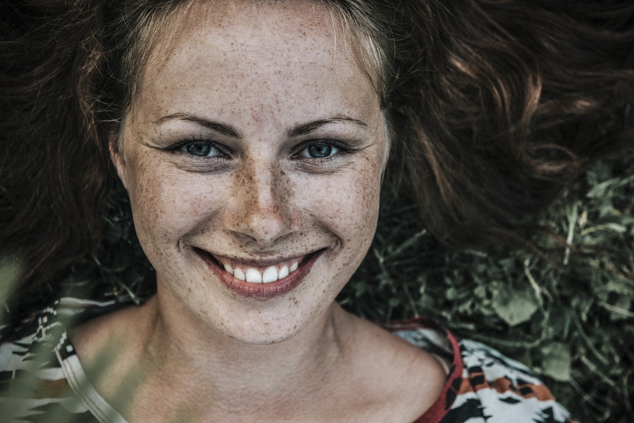 woman face freckles smile smiling 1867431